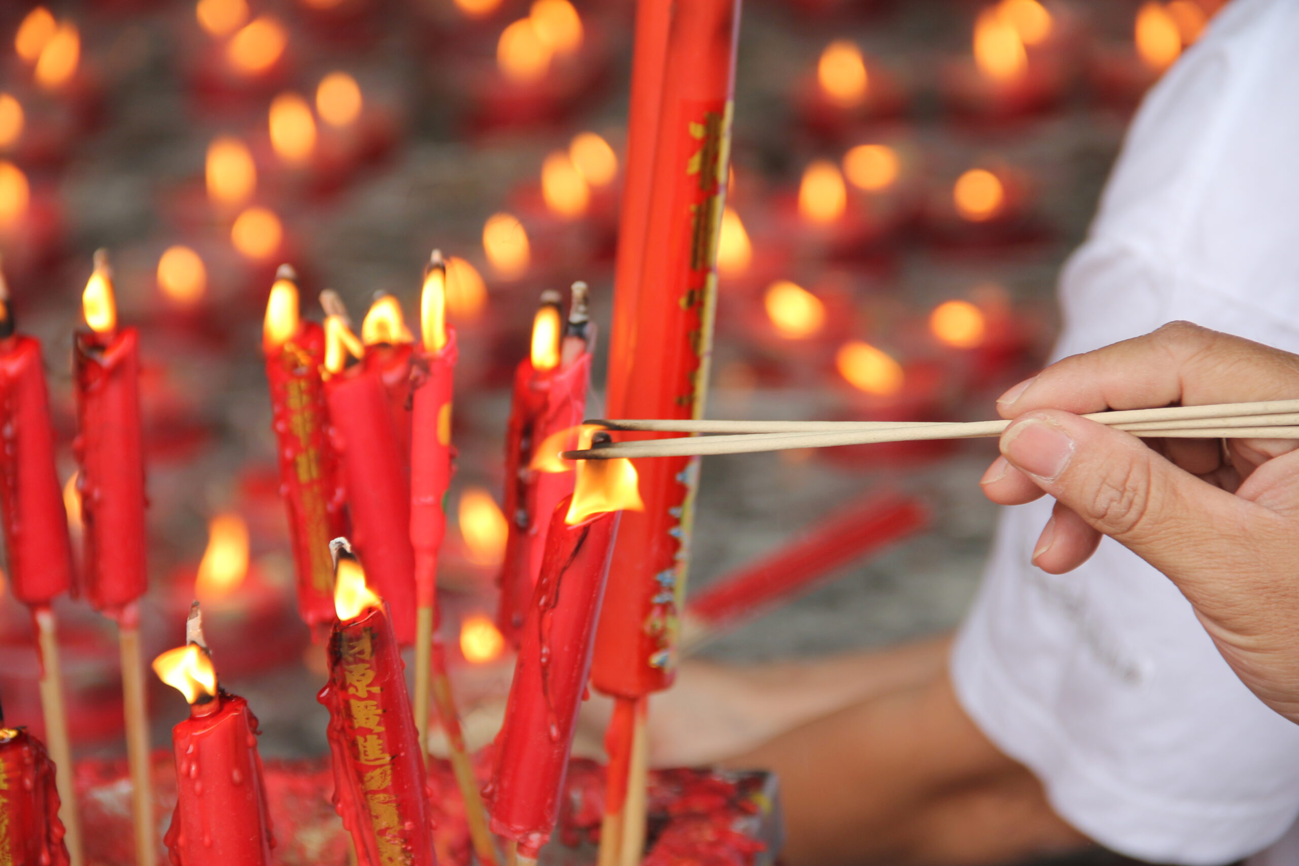 Bangkok - Lighting incense at local temple